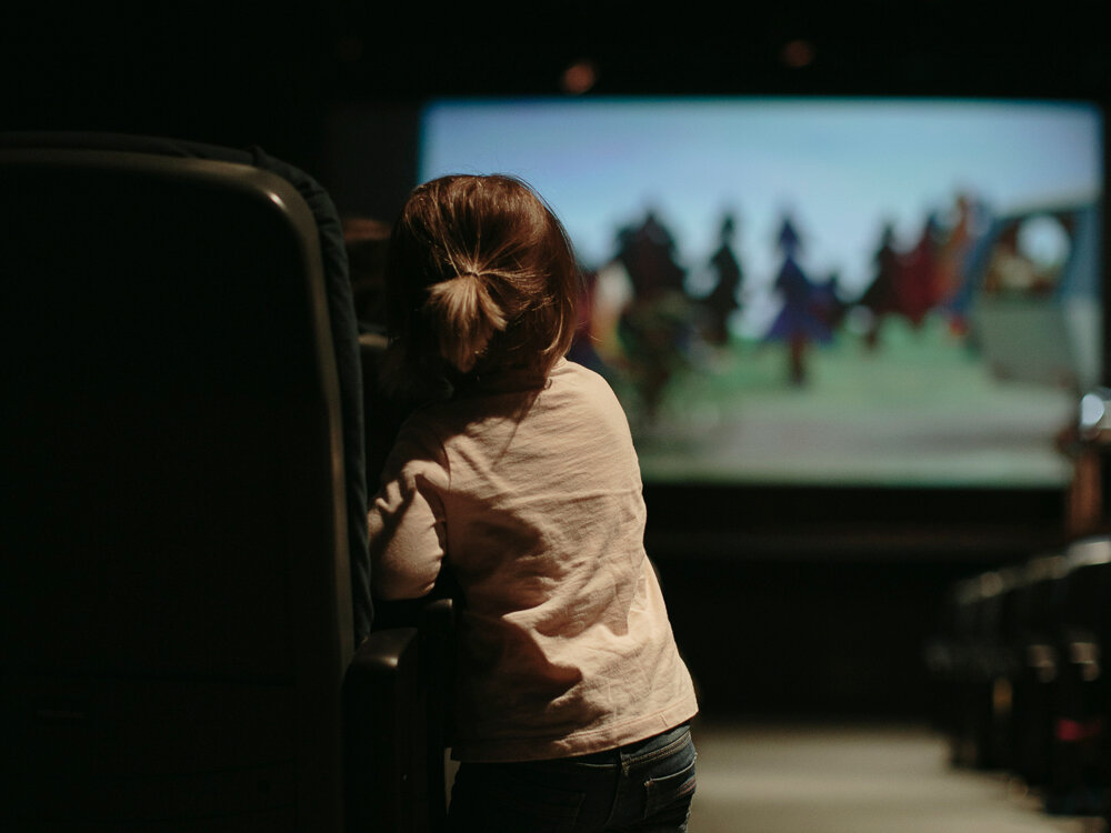 Little girl watching a movie